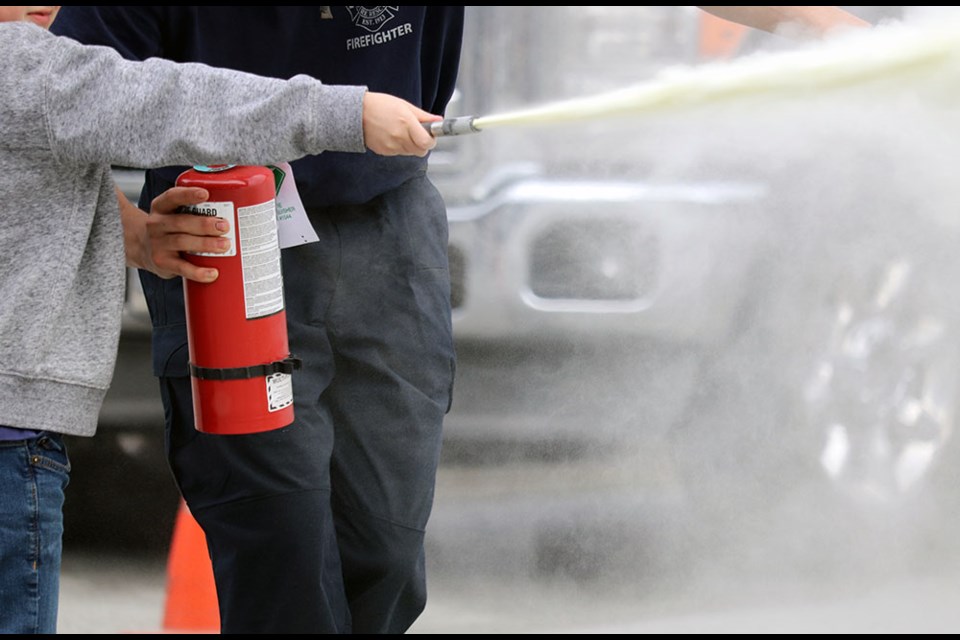 The inaugural class of Port Moody Fire Rescue (PMFR) junior firefighters taught elementary-school students on a Pro-D Day how to properly use fire extinguishers (April 21, 2023).