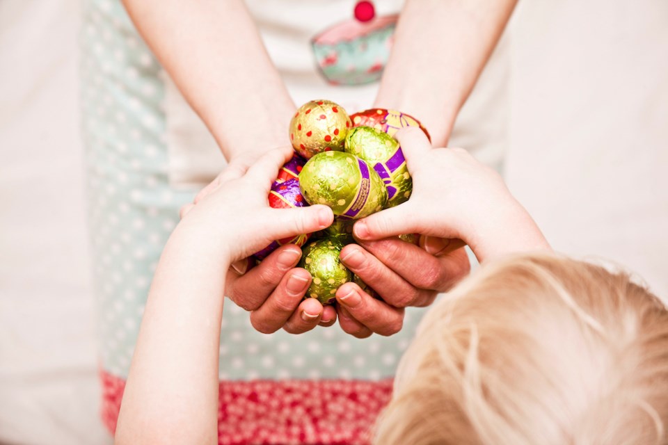 adult-hands-easter-chocolate-to-child