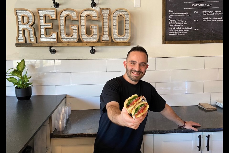 Matteo Belmonte serves up a sandwich at his new shop, Caffe Reggio, at 930 Brunette Ave. in Coquitlam.