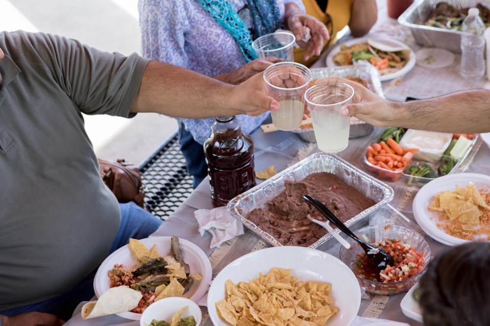 food-potluck-dinner-party-snacks-table-getty-images