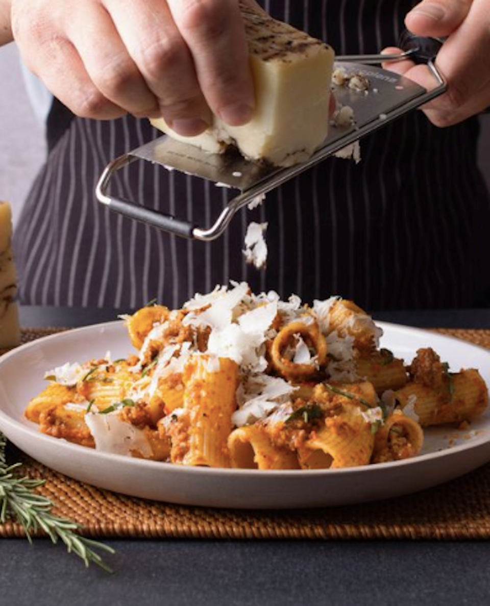 grating-cheese-on-rigatoni-cactus-club-coquitlam