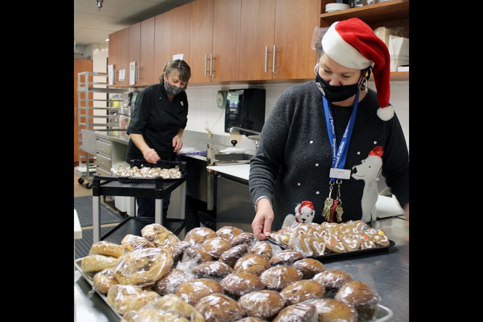 Coquitlam cooks Monica Hanser (front) and Jill Skabar prepare the meals in the Dogwood Pavilion commercial kitchen.