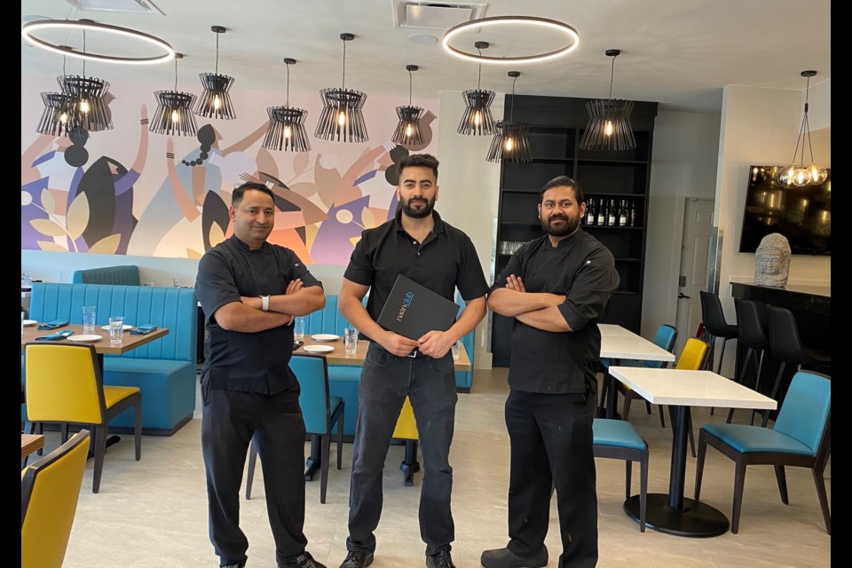 Chef Anil Dhoundiyal, manager Saral Dua and chef Sandeep Gouniyal are ready to serve customers in the dining room at the new Naan Club in Coquitlam.