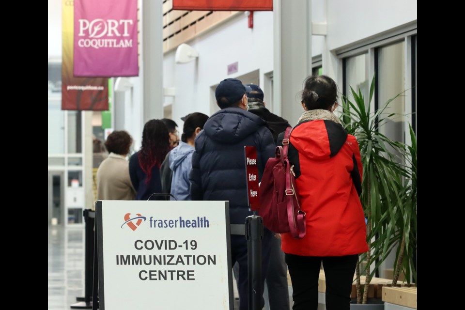 People looking to get their COVID-19 vaccine up-to-date line up at a new interim clinic set up by Fraser Health in the new Port Coquiltam Community Centre. The clinic will operate until Jan. 23 to meet demand while a larger facility is set up at the Poirier Forum in Coquitlam.