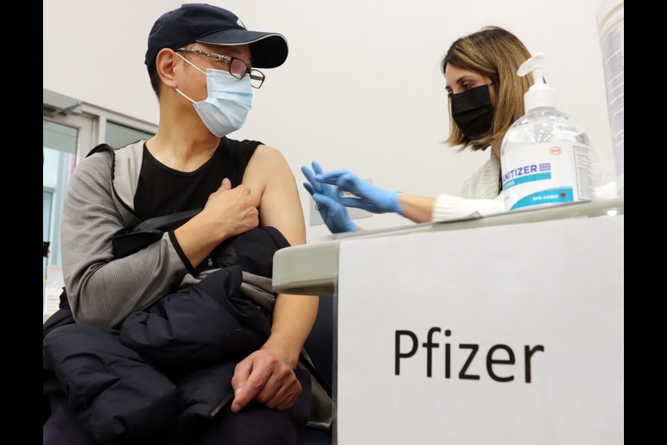 Visitors to the new interim COVID-19 vaccination clinic at the Port Coquitlam Community Centre get a choice of Pfizer or Modera vaccines.
