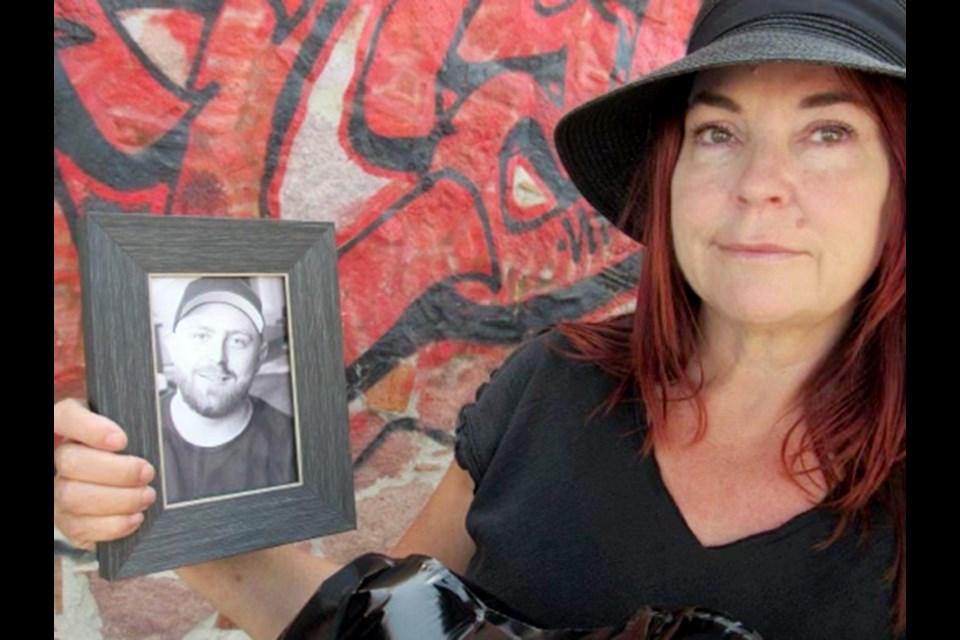 Vicki Cartwright holds a photo of her son, Harley, who died of fentanyl poisoning in Sept., 2020.