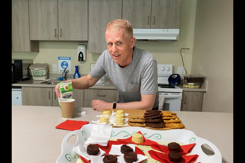 Chris Racine doles out snacks at Maplewood Manor's new kitchen.