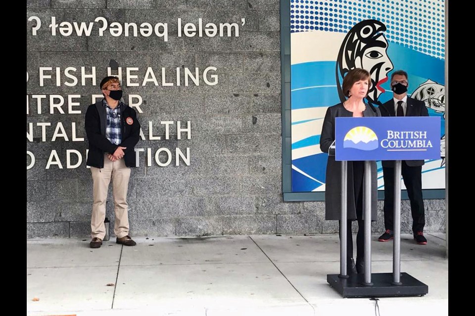 kʷikʷəƛ̓əm (Kwikwetlem) First Nation Chief Ed Hall (left) and B.C. mental health and addictions minister Sheila Malcolmson officially open the Red Fish Healing Centre in Coquitlam with Coquitlam-Burke Mountain MLA Fin Donnelly (at right).