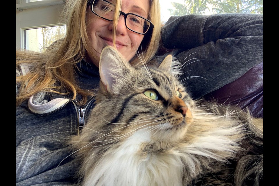 Ella the cat snuggles up to Jessie Bahrey's chest prior to her diagnosis of triple-negative breast cancer in January, 2023.