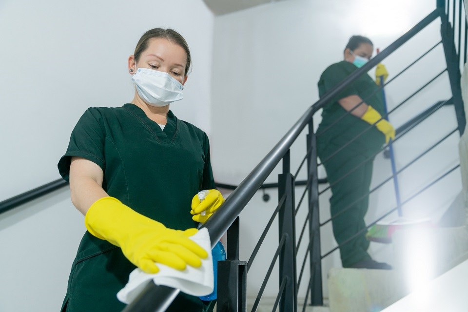 Women cleaning hospital stairs - Getty Images