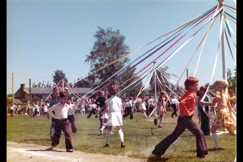 Port Coquitlam May Day photo of a maypole dance, taken in 1975.