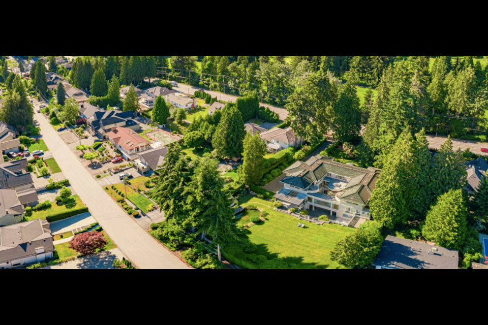 A home with a large yard at 730 Austin Ave., Coquitlam is for sale.