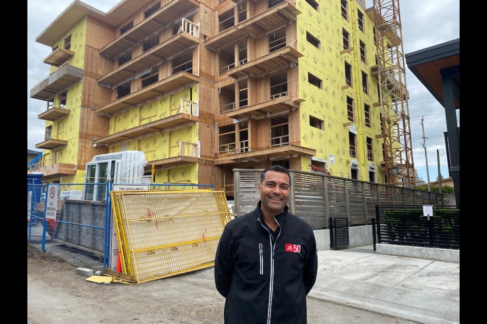 Rocky Sethi, of Adera Development outside RED Como Lake, a mass timber apartment currently under construction in Coquitlam.