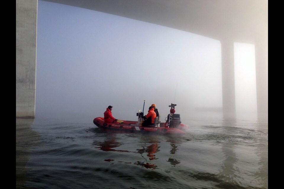 Coquitlam Search and Rescue on a task, in its old Zodiac boat.