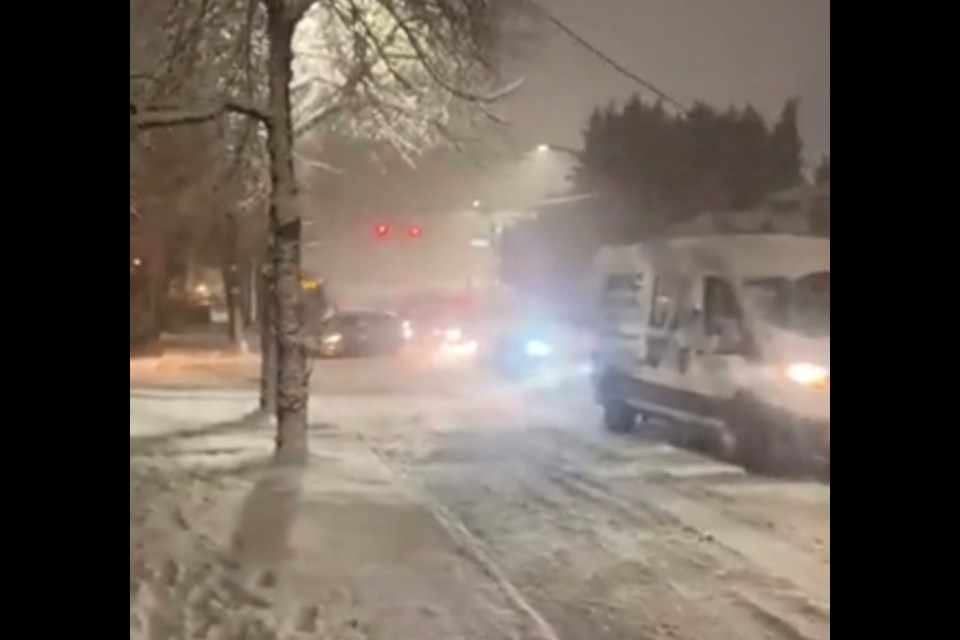 Several vehicles are left stuck on Marmont Street in Coquitlam as a result of a heavy snow storm the night of Nov. 29, 2022.