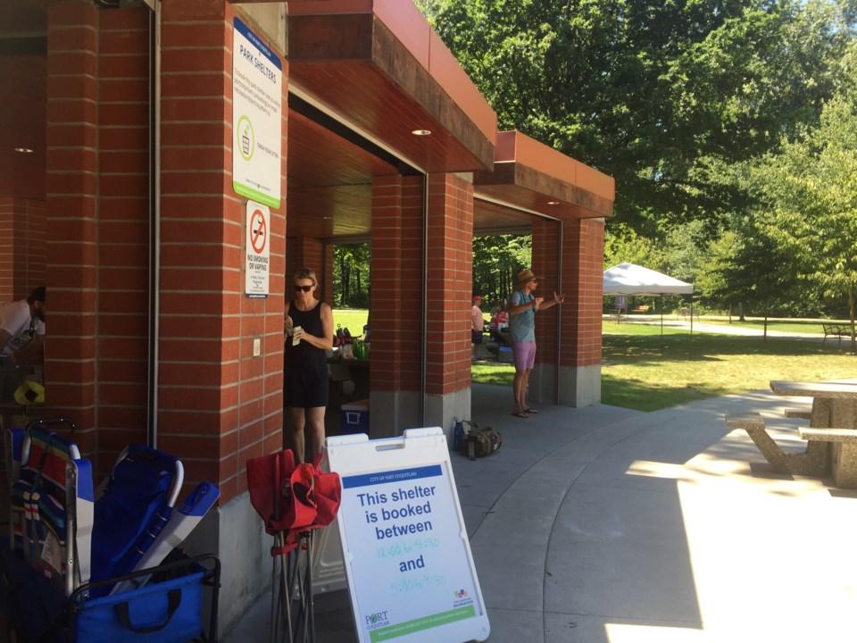 Visitors to Lions Park take shelter in the extreme heat