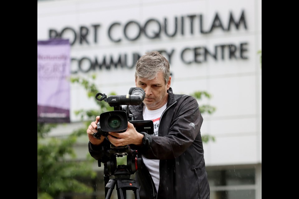 Geoff Scott, of Tri-Cities TV, lines up a shot outside the Port Coquitlam Community Centre. The community operation has received new grant money that will allow it to expand its coverage of the Tri-Cities.