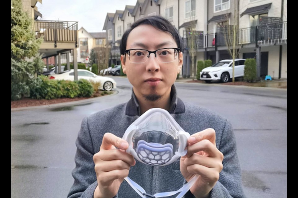 Yat Li with one of the clear masks he developed to promote communication for people who are deaf or hard of hearing.