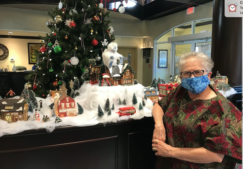 Pat Jensen Astoria resident with Christmas village