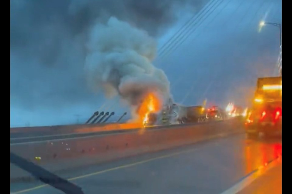A dump truck was seen engulfed in flames on the Port Mann Bridge the morning of Jan. 18, 2023, causing major eastbound Highway 1 traffic delays from Coquitlam to Surrey.