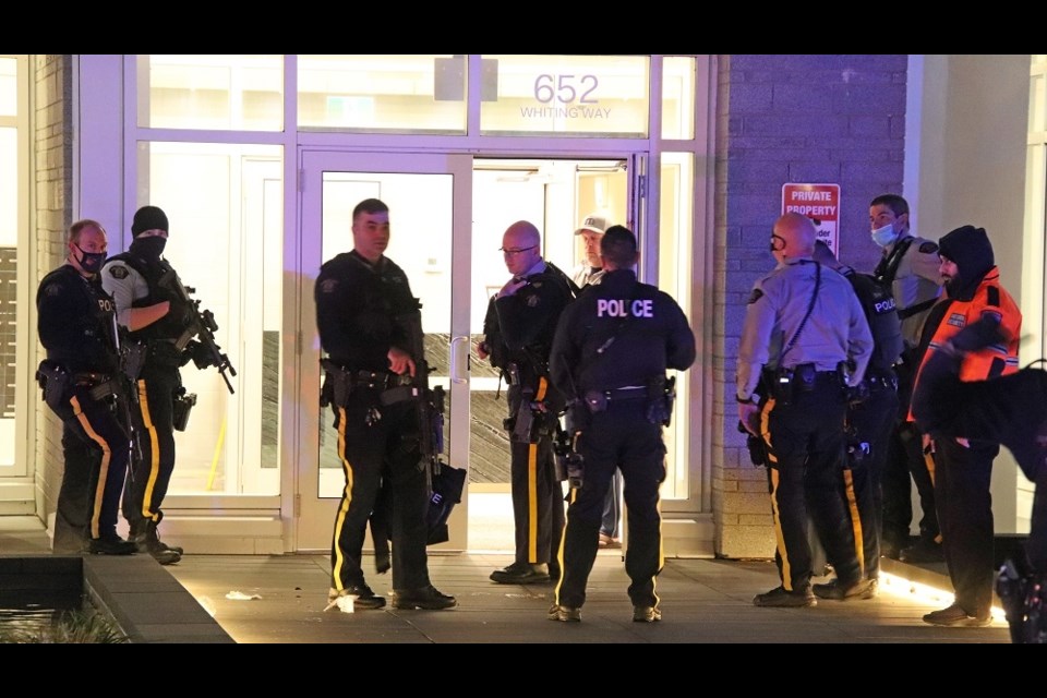 A massive police response, including the heavily armed RCMP Emergency Response Unit, outside a Burquitlam condo complex after reports a woman was shot and left bloodied on the lobby floor. 