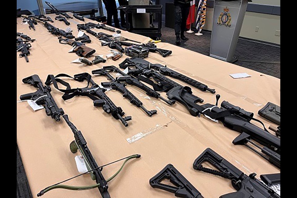 A Coquitlam business was subject of a search warrant on Dec. 1, 2022, in which RCMP seized dozens of firearms earmarked for trafficking.