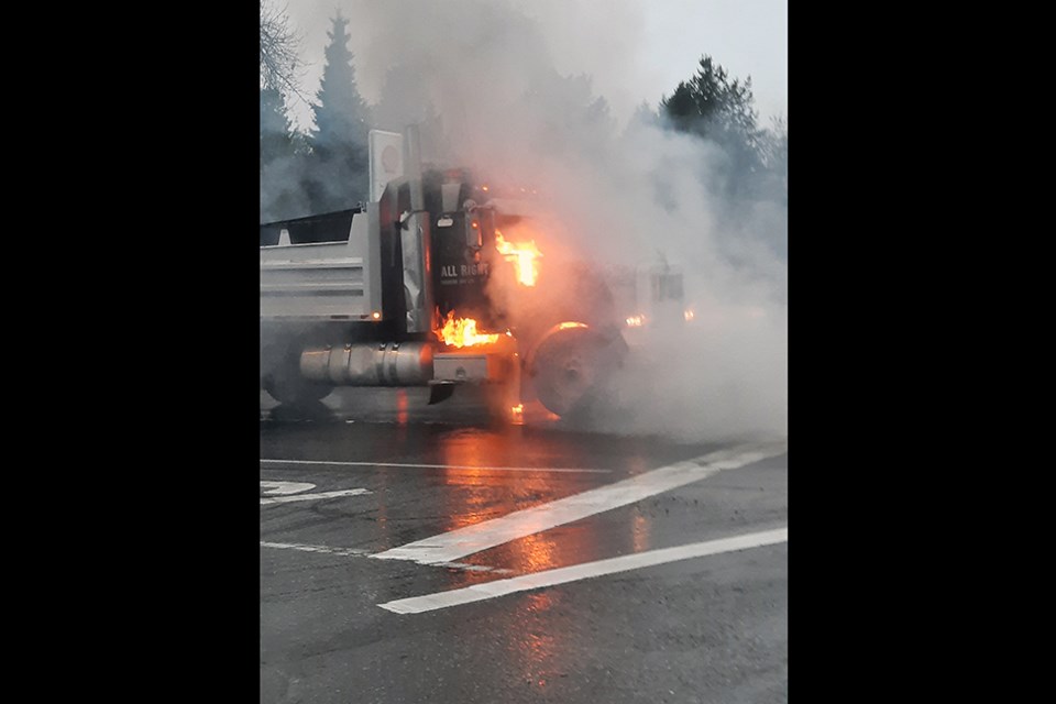 An apparent dump truck caught on fire along the Mary Hill Bypass (Highway 7B) in Port Coquitlam the morning of Nov. 30, 2021.