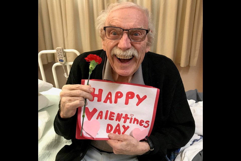 A Valentine's Day Card made by a School District 43 student puts a smile on the face of a resident of Dufferin Care Centre in Coquitlam.