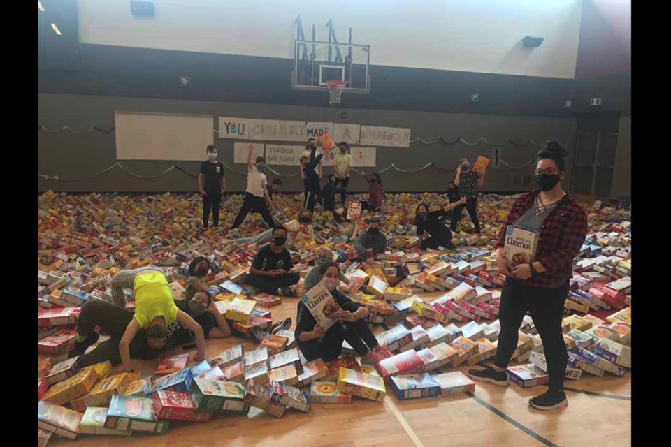 École Banting Middle School teacher Tiana Chan (right) organized a first-of-its-kind fundraiser that saw students collectmore than 2,000 cereal boxes for SHARE Food Bank.