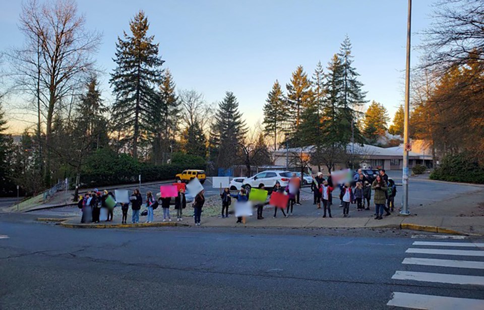 Port Moody parents and students rally outside Mountain Meadows Elementary the morning of Feb. 1, 2022, to support a teacher who recently "departed" from the school