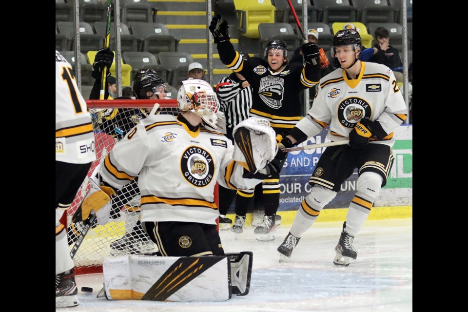 Coquitlam Express players celebrate Luke Roberts' game-tying goal early in the second period of their game against the Victorial Grizzlies, Friday at the Poirier Sport and Leisure Complex.