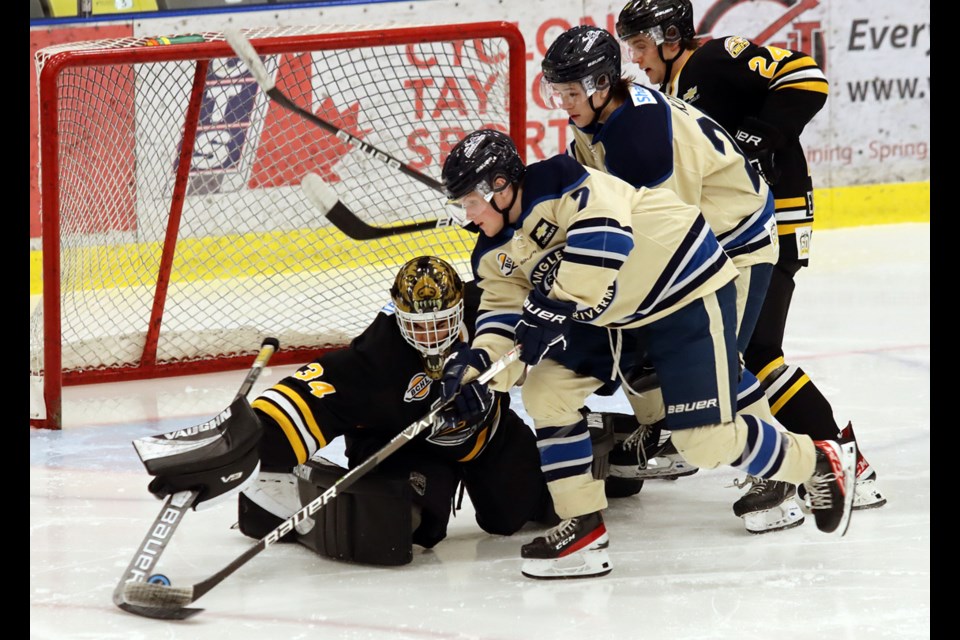 Coquitlam Express goalie Adam Manji stretches to knock the puck from Langley Rivermen forward Vitaly Levyy in the second period of their BC Hockey League game, Monday at the Poirier Sport and Leisure Complex. Walker Gelbard scored the decisive goal in the shootout to give the Rivermen a 7-6 win.