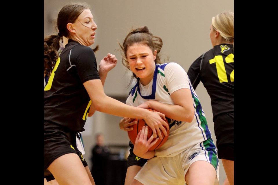 MARIO BARTEL/TRI-CITY NEWS
Riverside Rapids Avery Sussex battles for control of the ball in their quarter-final game against the Kelowna Owls, Thursday at the BC AAAA girls high school basketball championships at the Langley Events Centre.