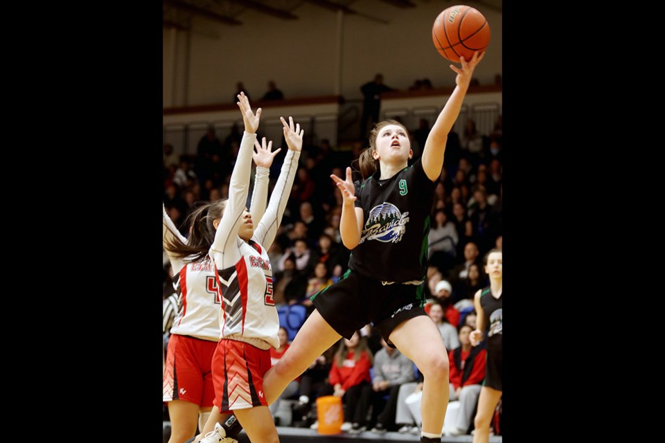 Riverside Rapids' Avery Sussex (#9) goes for a layup in the first half of their 2023 B.C. AAAA girls' high school basketball semifinal against the Burnaby Central Wildcats, Friday (March 3) at the Langley Events Centre.