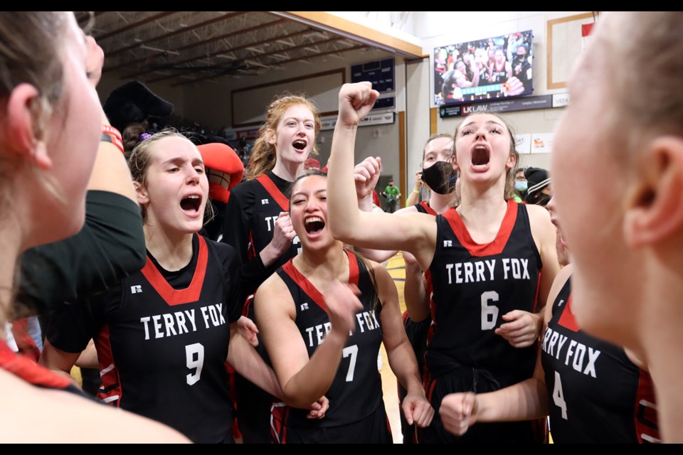 The Terry Fox Ravens celebrate their school's first AAAA senior girls basketball championship Saturday at the Langley Events Centre.