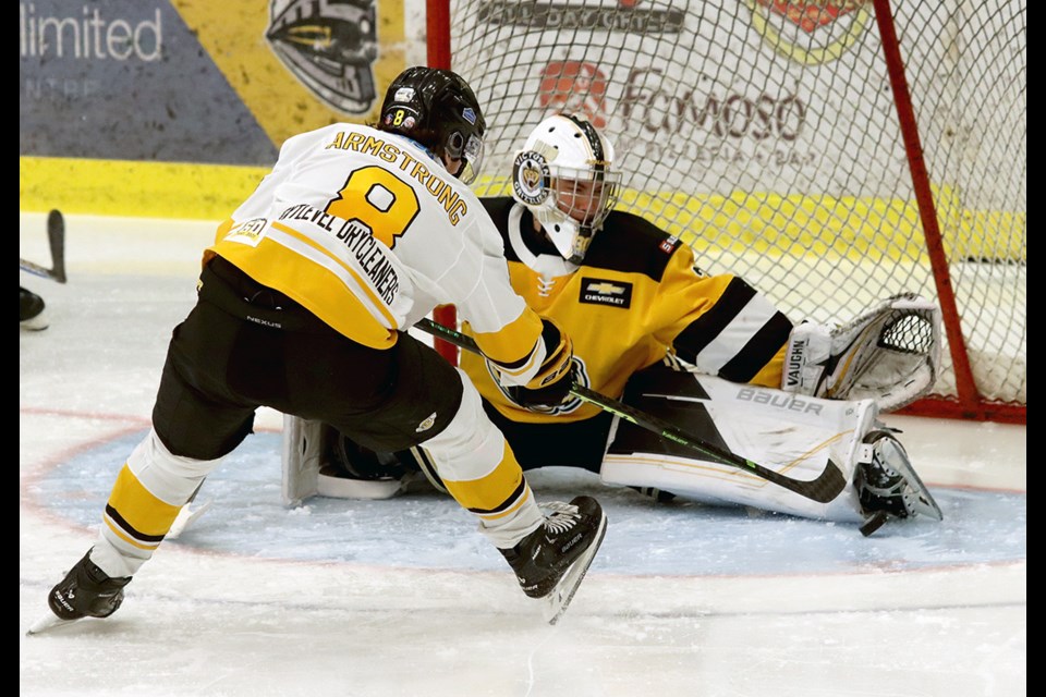 Victoria Grizzlies goalie Oliver Auyeung-Ashton stretches to make a toe save on Coquitlam Express forward Coco Armstrong in the second period of their BC Hockey League game, Saturday at the Poirier Sport and Leisure Complex.