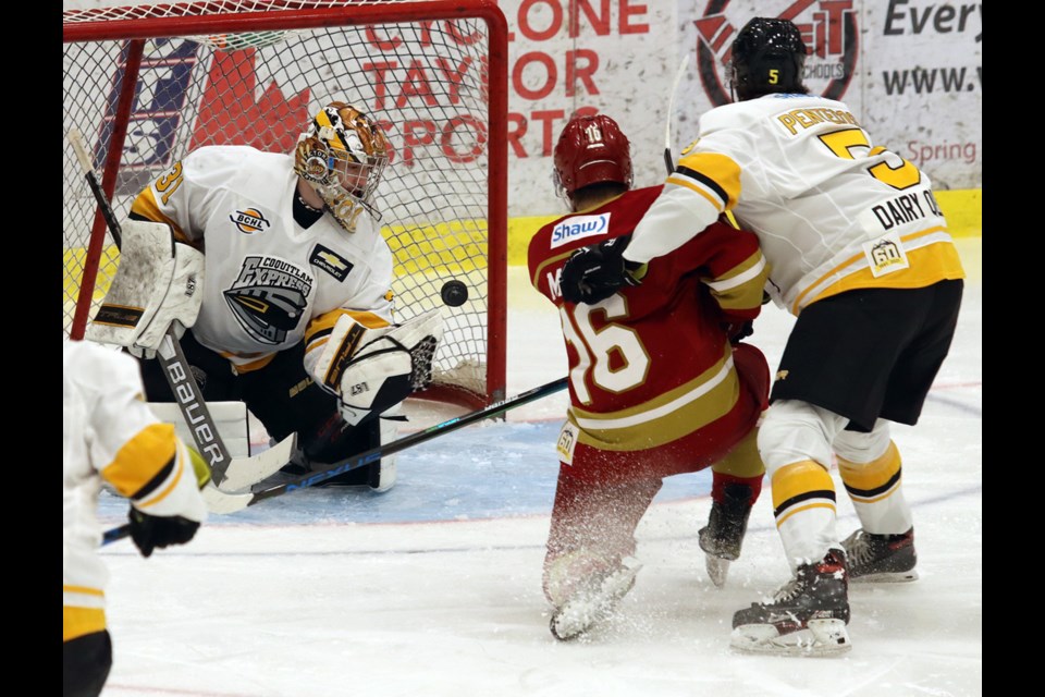 Coquitlam Express goalie Carter Woodside makes one of his 27 saves in the second period of their BC Hockey League playoff game against the Chilliwack Chiefs, Tuesday at the Poirier Sport and Leisure Complex.