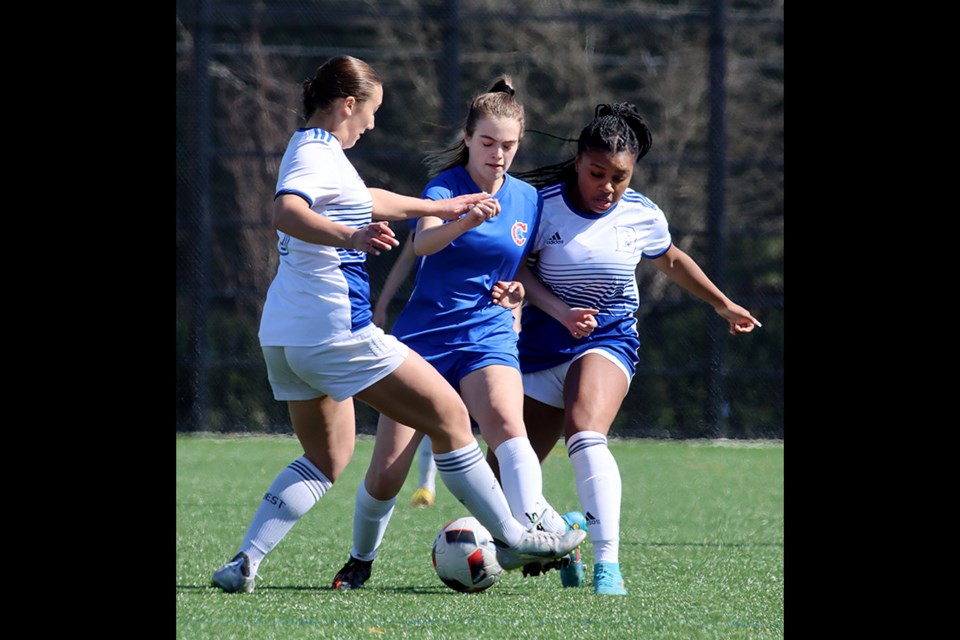 Centennial Centaurs Rachel Cardarelli tries to squeeze between Dr. Charles Best defenders Makayla Peluso and Maia Broughton in their championship match last Wednesday at Centennial's Kickoff Classic preseason tournament, The Centaurs won, 4-1.