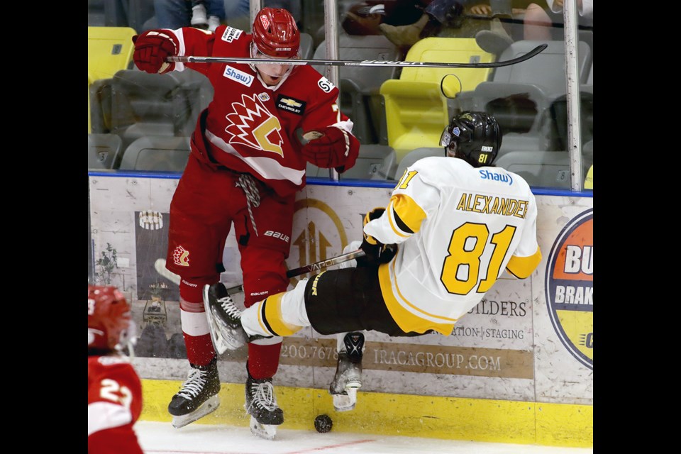 Coquitlam Express forward Colton Alexander is knocked off the puck by Chilliwack Chiefs defenseman Lucas Chorace in the first period of their BC Hockey League playoff game, Friday at the Poirier Sport and Leisure Complex.