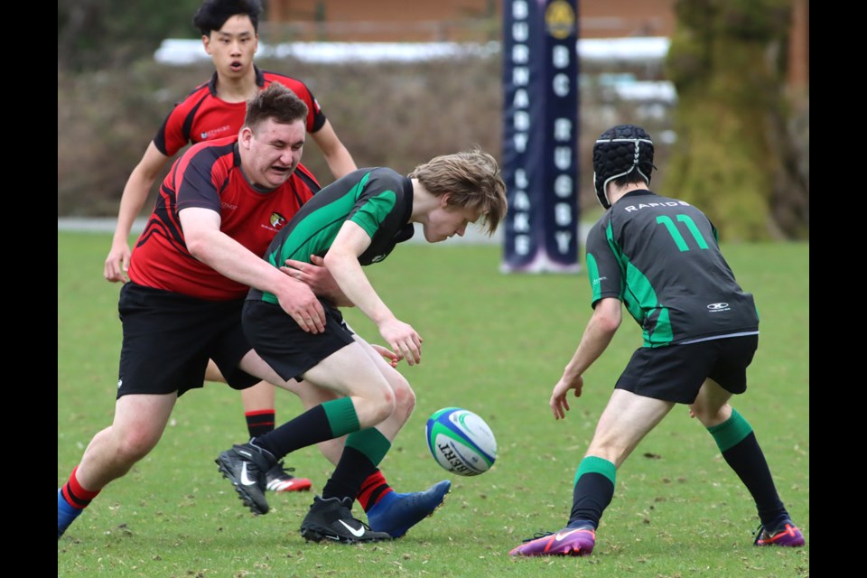 Riverside Rapids players scramble for the ball during a recent high school rugby match against Burnaby Central at the Burnaby Lake Sports Complex.