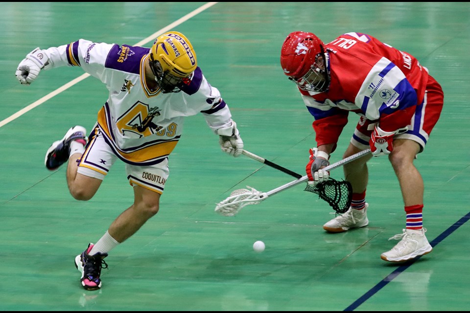 Coquitlam Adanacs defender Aiden Guld and New Westminster Salmonbellies defender Jordan Gilles battle for a loose ball in the first period of their Western Lacrosse Association game, last Thursday at Queens Park Arena. Coquitlam won, 13-11.