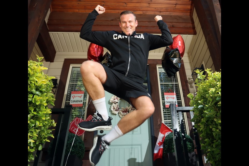 Adam Day's family set up a patriotic display at the front of their Coquitlam home when the assistant coach with Canada's national women's soccer team that won a gold medal at the Tokyo Olympics arrived home.