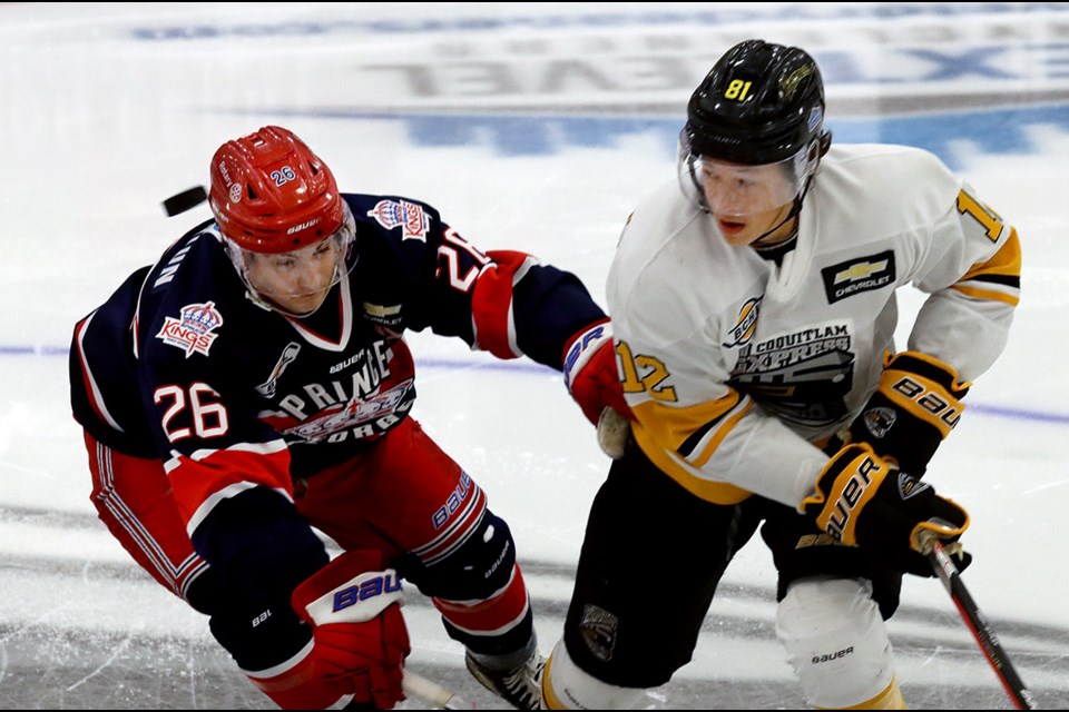 Coquitlam Express forward Colton Alexander battles with John Herrington of the Prince George Spruce Kings in the opening moments of their BC Hockey League season opening game, Friday at the Poirier Sport and Leisure Complex.