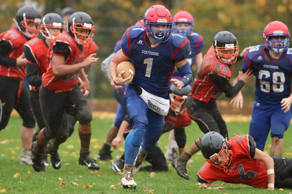 Centennial Centaurs running back Milan Ljutic runs for one of the two touchdowns he scored to power a 32-0 win over the New Westminster Hyacks in their BC Secondary Schools Football Association junior varsity game last Thursday at the Centennial Oval. Harry Lobay also scored a pair of touchdowns. 