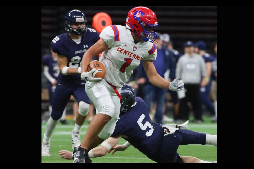 Centennial Centaurs running back Ziad Sabry (#1) eludes GW Graham Grizzlies tacklers in the first half of their BC Secondary Schools Football Association Subway Bowl semifinal game, Saturday at BC Place Stadium. The Grizzlies won, 19-0.