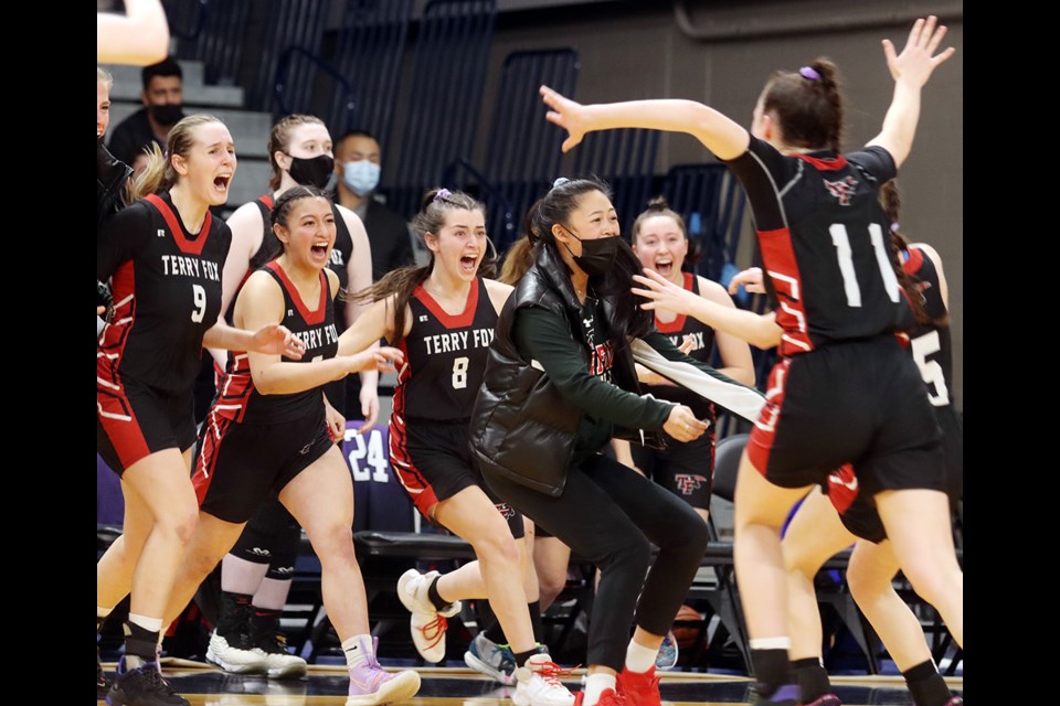 The senior girls AAAA high school basketball final was one of the most intense games I've ever covered. The fact it was between two Port Coquitlam rivals heightened its excitement. But with time running out and the winner still up in the air, I had to decide where I needed to be to get the decisive moment. So I pulled up stakes from my usual spot at the baseline and headed to midcourt across from the benches figuring either way, something would happen. It did.