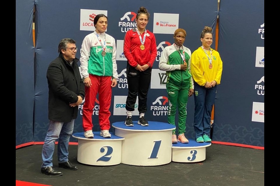 Coquitlam's Ana Godinez Gonzalez (middle) won gold in the 62 kg weight class at the 2023 French Grand Prix.