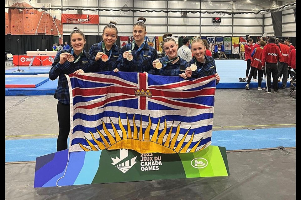 Belcarra's Elizabeth Noble (right) smiles with her B.C. teammates at the 2023 Canada Winter Games on Prince Edward Island.
