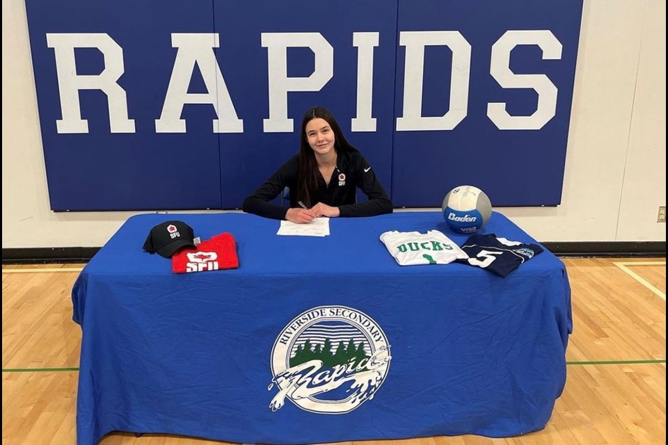 Jayden Armstrong of Port Coquitlam's Riverside Secondary sign with SFU volleyball for NCAA Div. II play in fall 2023.