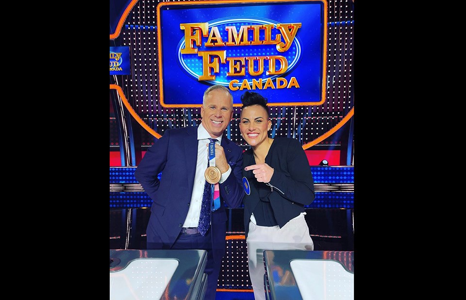 Port Coquitlam's Jenn Salling is pictured with Family Feud Canada host Gerry Dee with her Tokyo 2020 bronze medal. Her episode airs Jan. 6, 2022.